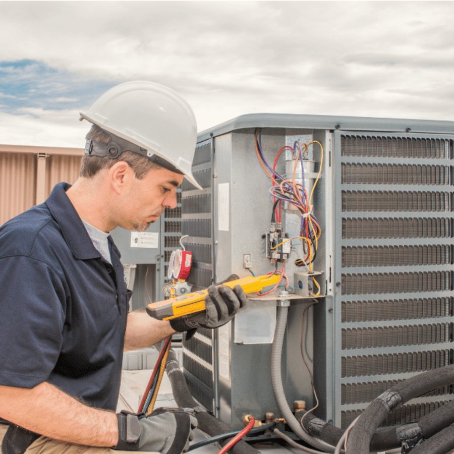 London Geothermal technician inspecting a WaterFurnace ground-source heat pump during a residential loop installation in London, Ontario